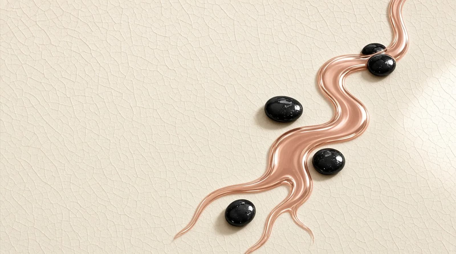 Liquid rose-gold stream flowing across cream crackle-glaze tile with black pebbles.